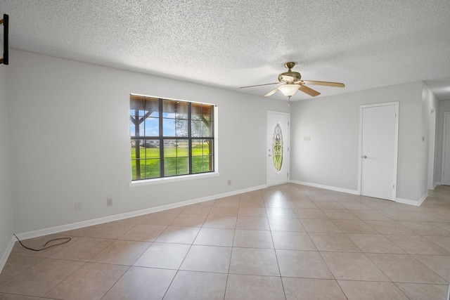 190 Rs County Road 4330, Point, TX 75472 - unfurnished room with a ceiling fan, a textured ceiling, light tile patterned floors, and baseboards