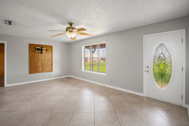 190 Rs County Road 4330, Point, TX 75472 - foyer entrance featuring ceiling fan, a textured ceiling, light tile patterned floors, and baseboards