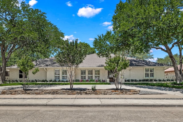 4315 Laren Ln, Dallas, TX 75244 - view of front of home featuring brick siding and curved driveway