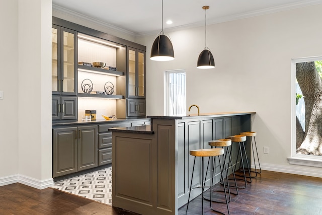 4315 Laren Ln, Dallas, TX 75244 - bar with baseboards, wood-type flooring, crown molding, hanging light fixtures, and recessed lighting