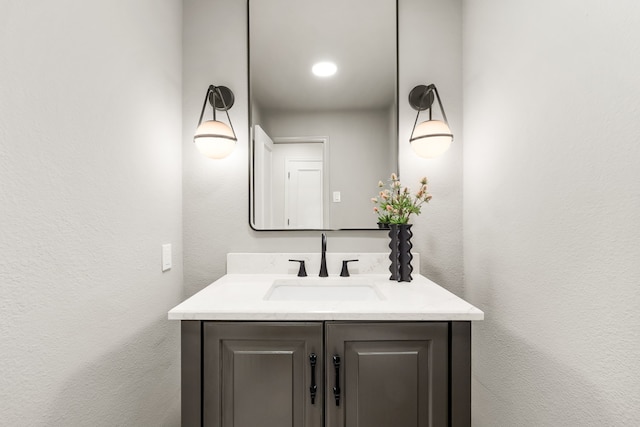 4315 Laren Ln, Dallas, TX 75244 - bathroom with vanity and a textured wall