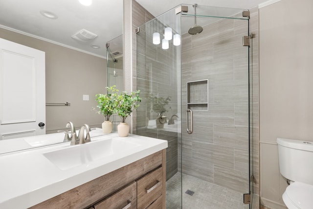 4315 Laren Ln, Dallas, TX 75244 - full bath featuring toilet, vanity, a stall shower, and crown molding