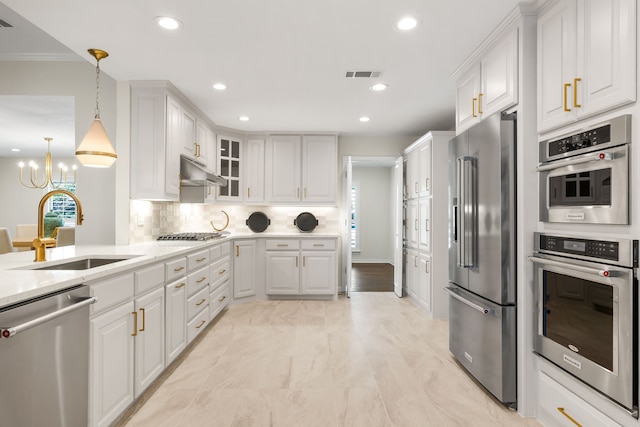 4315 Laren Ln, Dallas, TX 75244 - kitchen featuring stainless steel appliances, a sink, white cabinets, a chandelier, and recessed lighting