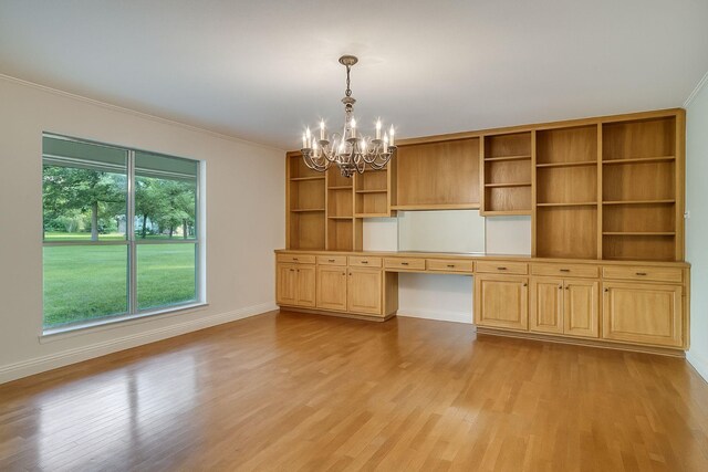 915 Cockrell Hill Rd, Ovilla, TX 75154 - unfurnished office with built in desk, a chandelier, light wood-style floors, ornamental molding, and baseboards