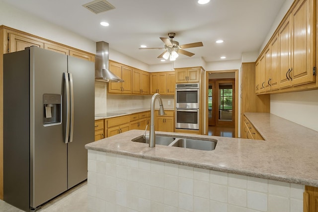 915 Cockrell Hill Rd, Ovilla, TX 75154 - kitchen featuring appliances with stainless steel finishes, wall chimney exhaust hood, ceiling fan, light countertops, and a sink