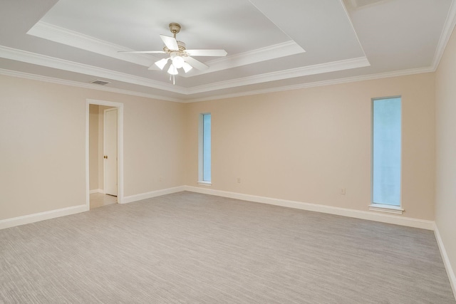 915 Cockrell Hill Rd, Ovilla, TX 75154 - empty room featuring a tray ceiling, ceiling fan, crown molding, light carpet, and baseboards