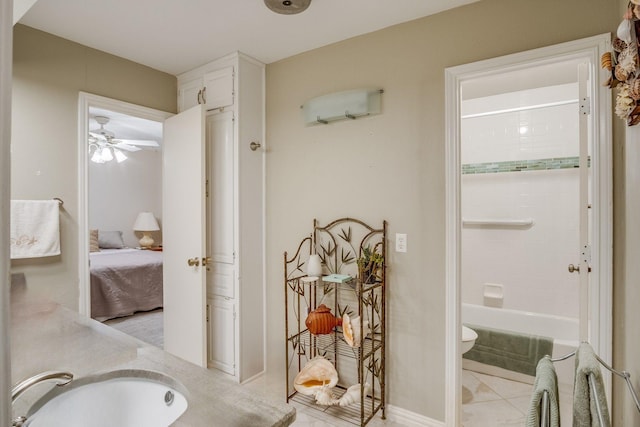 915 Cockrell Hill Rd, Ovilla, TX 75154 - full bathroom with double vanity, tile patterned flooring, washtub / shower combination, toilet, and ensuite bathroom