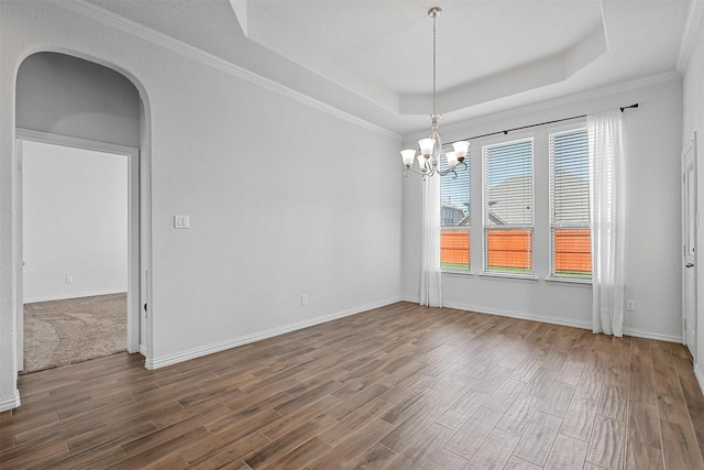 15232 Primrose Garden Ct, Aledo, TX 76008 - unfurnished room with a tray ceiling, dark wood-style flooring, a chandelier, arched walkways, and ornamental molding