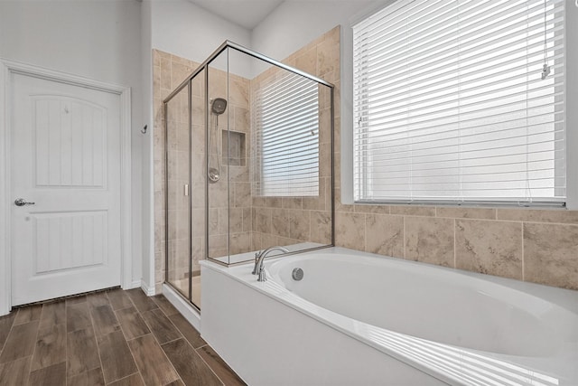 15232 Primrose Garden Ct, Aledo, TX 76008 - bathroom featuring a garden tub, a stall shower, and wood finished floors