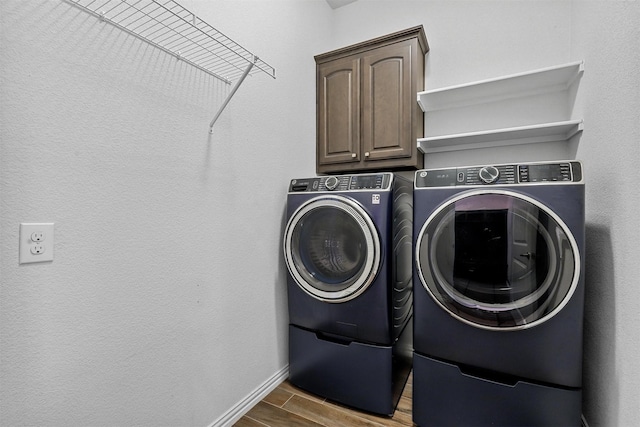 15232 Primrose Garden Ct, Aledo, TX 76008 - laundry area with separate washer and dryer, wood tiled floors, cabinet space, and baseboards