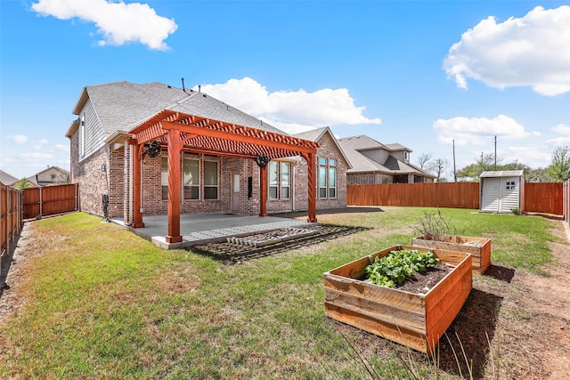 15232 Primrose Garden Ct, Aledo, TX 76008 - back of house featuring a pergola, a vegetable garden, a patio area, brick siding, and roof with shingles