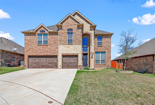 15232 Primrose Garden Ct, Aledo, TX 76008 - view of front of house with an attached garage, brick siding, concrete driveway, a front lawn, and cooling unit