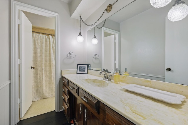 2500 Indian Hills Dr, Plano, TX 75075 - full bath with vanity, wood finished floors, and curtained shower