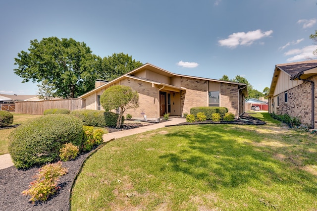 4218 Aralia St, Mesquite, TX 75150 - mid-century home with brick siding and a chimney