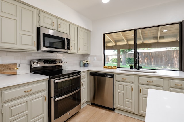 4218 Aralia St, Mesquite, TX 75150 - kitchen with appliances with stainless steel finishes, a sink, light countertops, and recessed lighting
