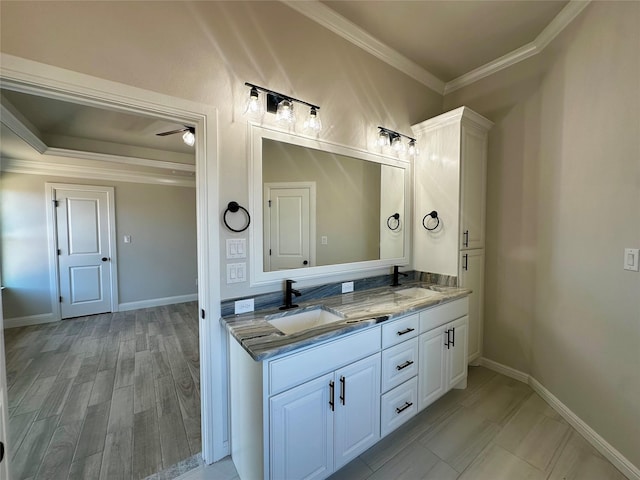 1406 Oleander Dr, Tolar, TX 76476 - full bathroom with crown molding, double vanity, ceiling fan, and baseboards