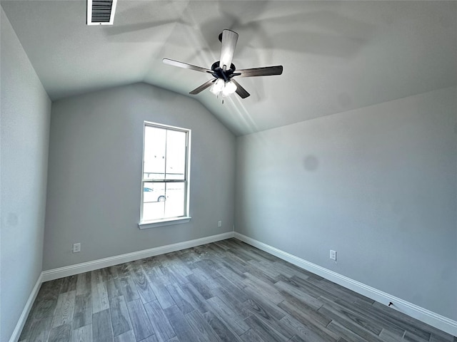 1406 Oleander Dr, Tolar, TX 76476 - bonus room featuring a ceiling fan, dark wood-style flooring, lofted ceiling, and baseboards