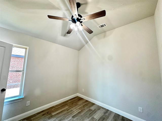 1406 Oleander Dr, Tolar, TX 76476 - empty room with dark wood-style flooring, ceiling fan, baseboards, and vaulted ceiling