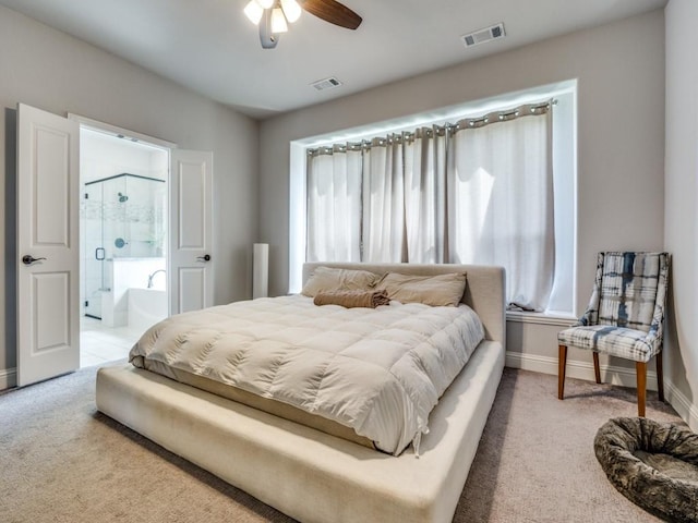 1241 Ronald St, Desoto, TX 75115 - bedroom with light colored carpet, baseboards, ensuite bath, and ceiling fan
