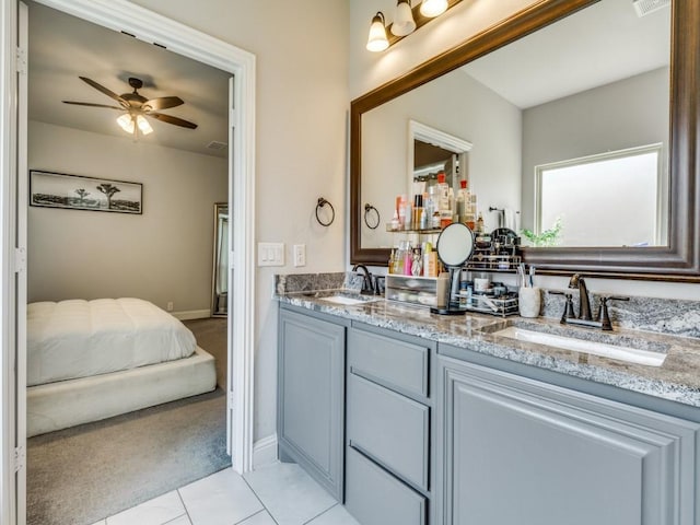 1241 Ronald St, Desoto, TX 75115 - full bathroom with ceiling fan, double vanity, tile patterned flooring, ensuite bathroom, and baseboards