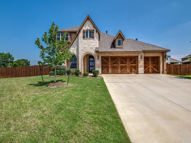 1241 Ronald St, Desoto, TX 75115 - view of front of property featuring stone siding, a garage, concrete driveway, and roof with shingles
