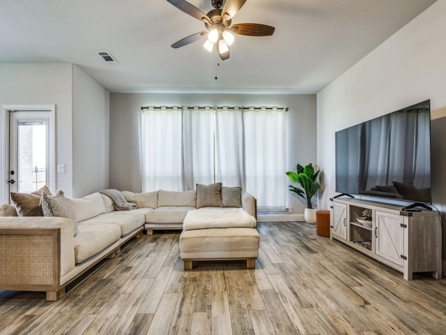 1241 Ronald St, Desoto, TX 75115 - living area with light wood finished floors and a ceiling fan
