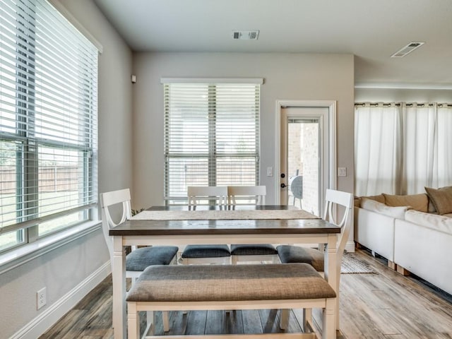 1241 Ronald St, Desoto, TX 75115 - dining space featuring healthy amount of natural light, wood finished floors, and baseboards
