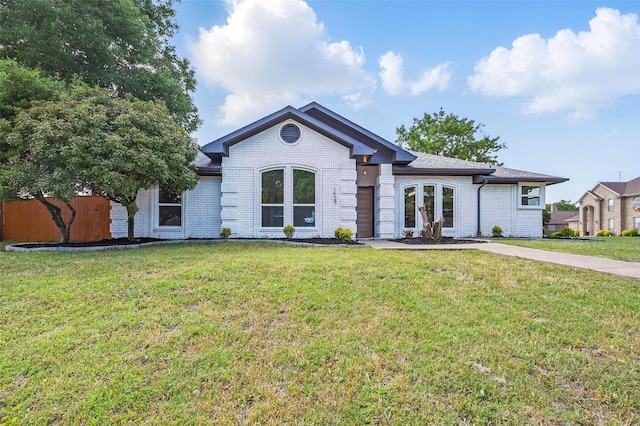 1429 Waterford Pl, Garland, TX 75044 - single story home with brick siding and a front lawn