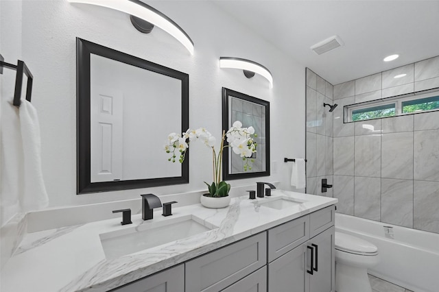 1429 Waterford Pl, Garland, TX 75044 - bathroom with toilet, double vanity, and shower / bath combination