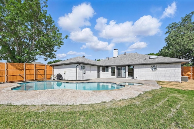 1429 Waterford Pl, Garland, TX 75044 - view of swimming pool featuring a patio area, a pool with connected hot tub, and central AC unit