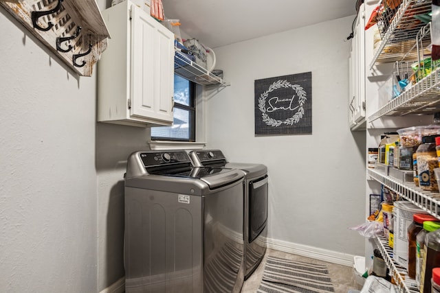 2928 Regal Rd, Plano, TX 75075 - laundry area with separate washer and dryer, cabinet space, and baseboards