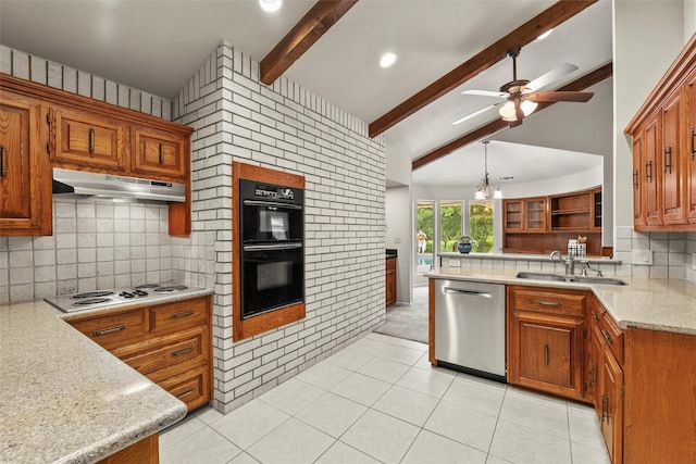 1210 Spring Lake Dr, Duncanville, TX 75137 - kitchen with stainless steel dishwasher, under cabinet range hood, a sink, a ceiling fan, and brown cabinetry
