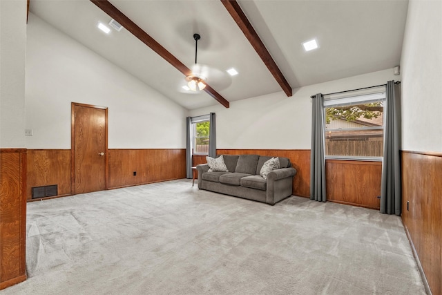 1210 Spring Lake Dr, Duncanville, TX 75137 - living area featuring wainscoting, wooden walls, a ceiling fan, and carpet flooring