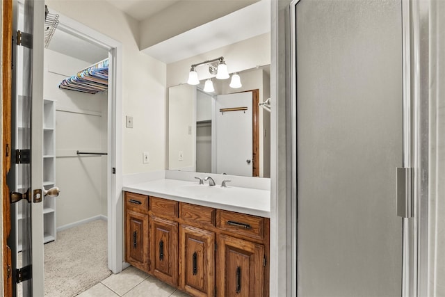 1210 Spring Lake Dr, Duncanville, TX 75137 - full bath with a walk in closet, vanity, a stall shower, and tile patterned flooring