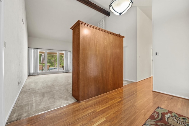 1210 Spring Lake Dr, Duncanville, TX 75137 - unfurnished room with wood finished floors, beam ceiling, baseboards, and high vaulted ceiling