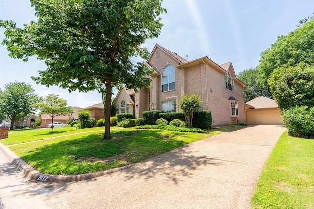 2017 Rumson Dr, Arlington, TX 76006 - traditional-style house featuring brick siding, a front lawn, and a garage