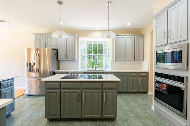 2017 Rumson Dr, Arlington, TX 76006 - kitchen featuring stainless steel appliances, a sink, a kitchen island, gray cabinetry, and light countertops