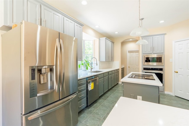 2017 Rumson Dr, Arlington, TX 76006 - kitchen with stainless steel appliances, a sink, light countertops, recessed lighting, and a kitchen island