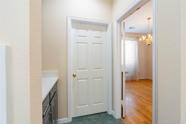 2017 Rumson Dr, Arlington, TX 76006 - hall featuring a chandelier