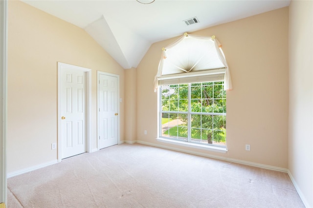 2017 Rumson Dr, Arlington, TX 76006 - unfurnished bedroom featuring carpet flooring, two closets, baseboards, and vaulted ceiling