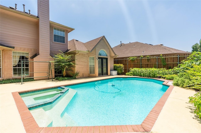 2017 Rumson Dr, Arlington, TX 76006 - view of pool featuring a pool with connected hot tub and a patio