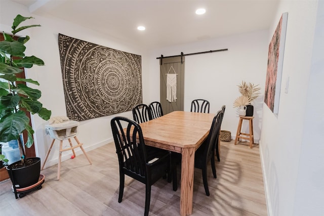 405 Valcik, Decatur, TX 76234 - dining space featuring light wood-style floors, a barn door, recessed lighting, and baseboards