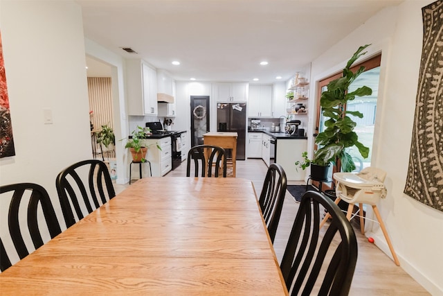 405 Valcik, Decatur, TX 76234 - dining space with light wood-style flooring, recessed lighting, and baseboards