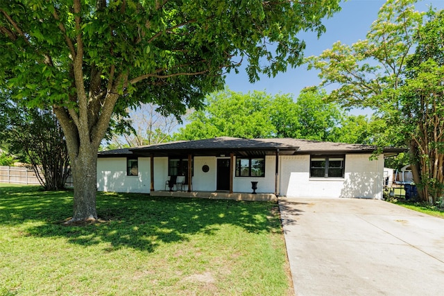 405 Valcik, Decatur, TX 76234 - ranch-style house featuring a porch, concrete driveway, and brick siding