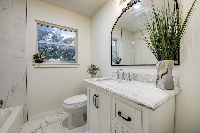 1601 Elizabeth Dr, Garland, TX 75042 - full bath with marble look tile flooring, vanity, toilet, and baseboards