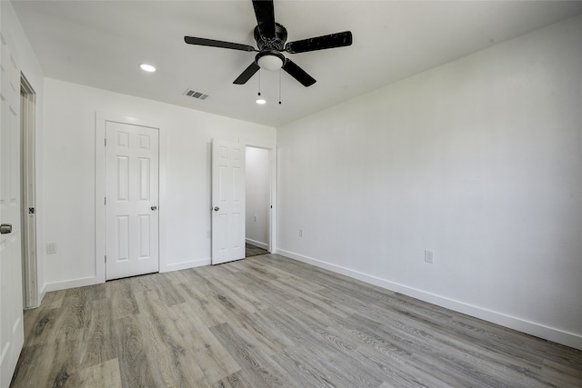 1601 Elizabeth Dr, Garland, TX 75042 - unfurnished bedroom featuring wood finished floors, recessed lighting, baseboards, and a ceiling fan