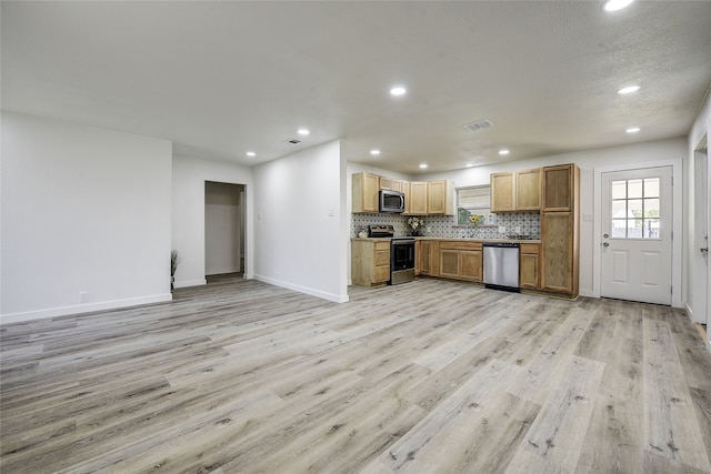 1601 Elizabeth Dr, Garland, TX 75042 - kitchen featuring appliances with stainless steel finishes, recessed lighting, light wood-style floors, backsplash, and baseboards