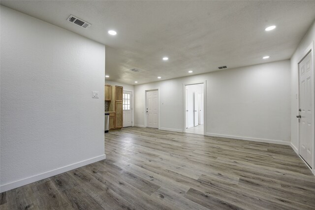 1601 Elizabeth Dr, Garland, TX 75042 - unfurnished room with recessed lighting, baseboards, and light wood-style flooring