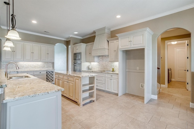 160 Solano Cir, Aledo, TX 76008 - kitchen featuring oven, arched walkways, a sink, built in microwave, and recessed lighting