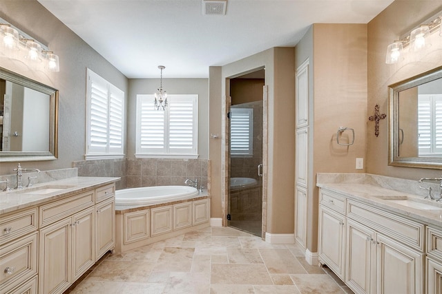 160 Solano Cir, Aledo, TX 76008 - bathroom with a shower stall, two vanities, a garden tub, and a chandelier